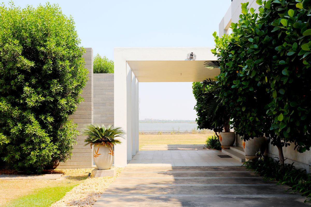 Modern concrete driveway leading to home